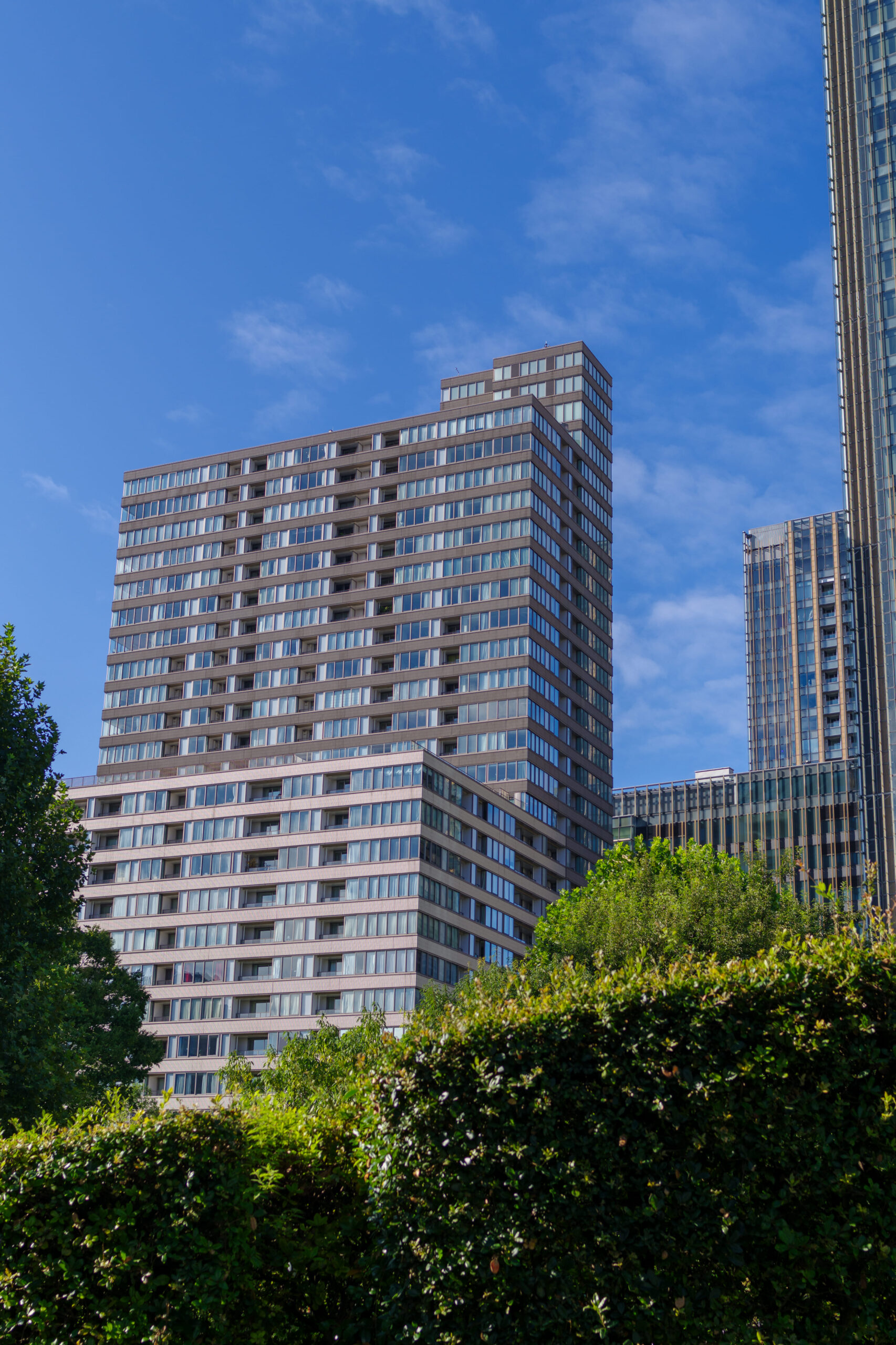 low-angle-view-modern-buildings-against-blue-sky (1)